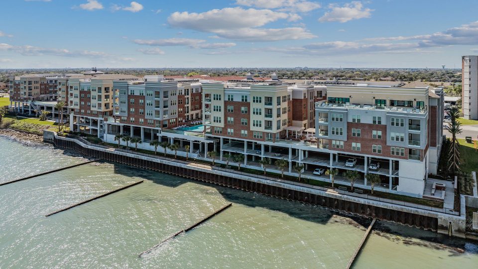 an aerial view of a waterfront apartment complex at The  Alexa