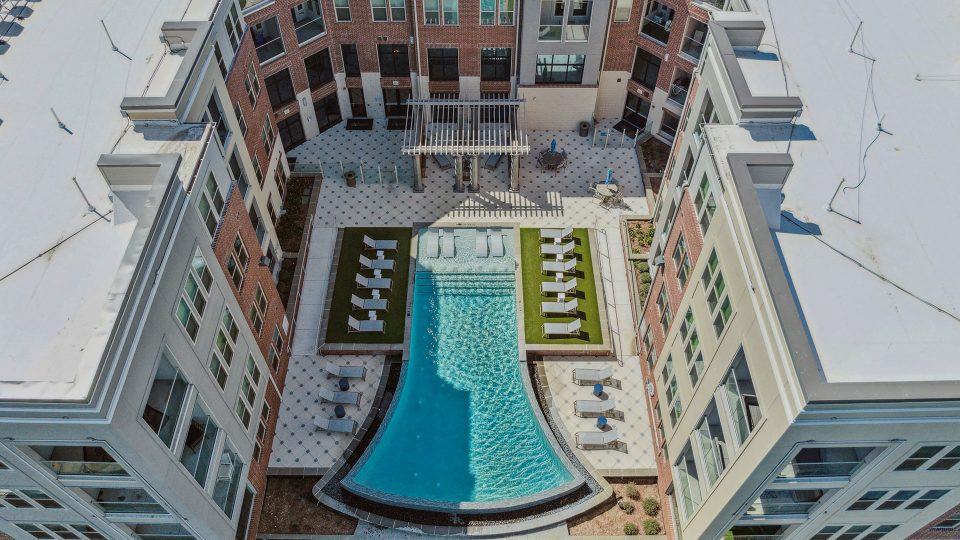 an aerial view of a pool and patio area at The  Alexa