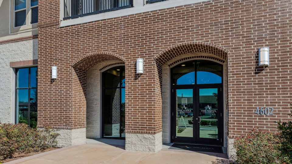the entrance to a building with two arched windows at The  Alexa